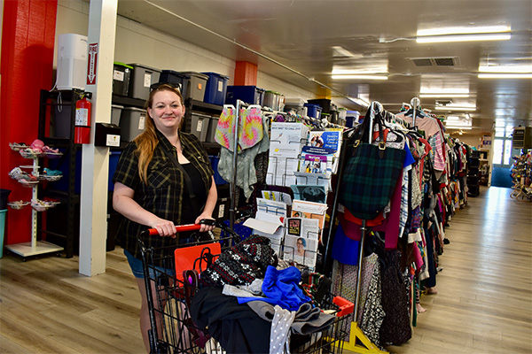 A foster parent browses donated clothing at Sweet Potato's Closet in Hermiston, Oregon