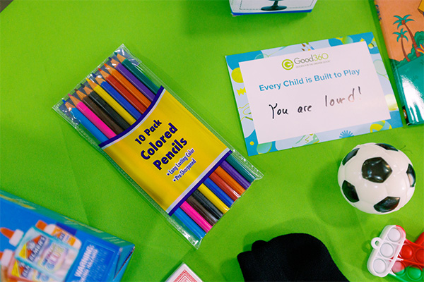 Volunteers pack play kits with school supplies and activities for children affected by the 2025 Kentucky tornadoes at a Good360 kitting event in Maysville, Kentucky